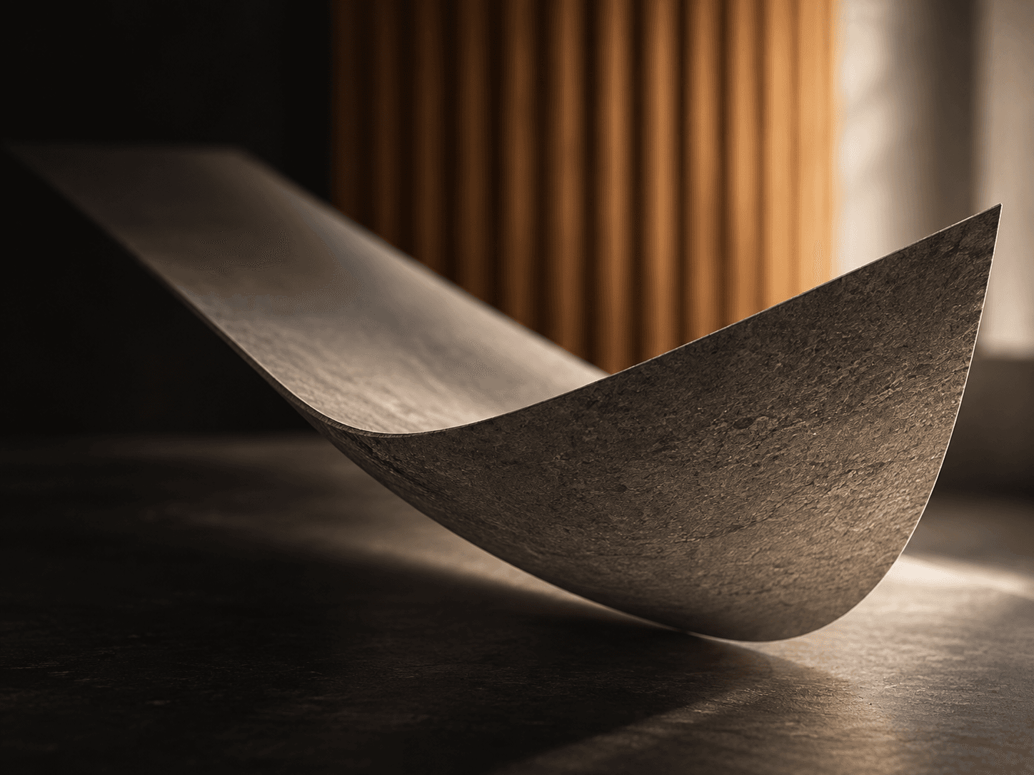 Flexible PHOMI material bending into a curved architectural form